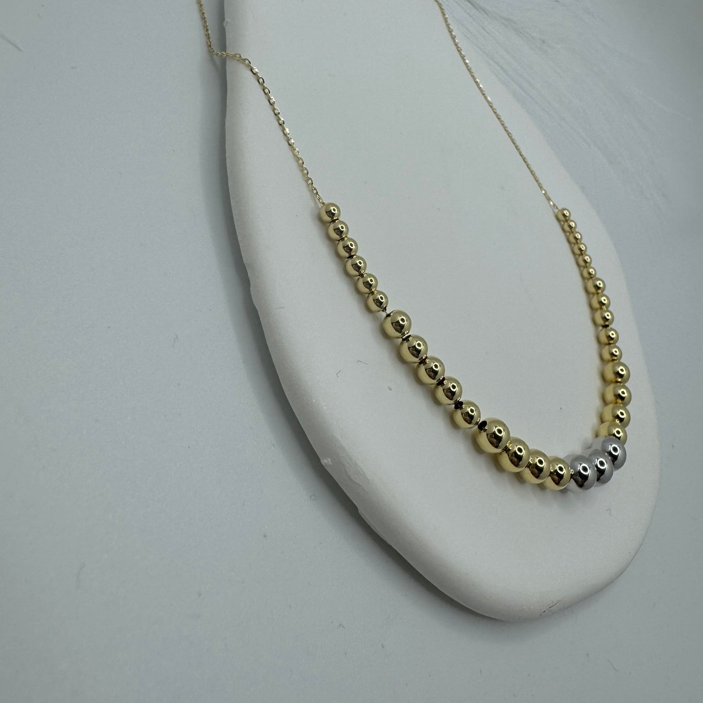 Collana rollò con sfere bicolor oro